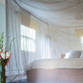 Silver-fabric bed canopy with floor mat